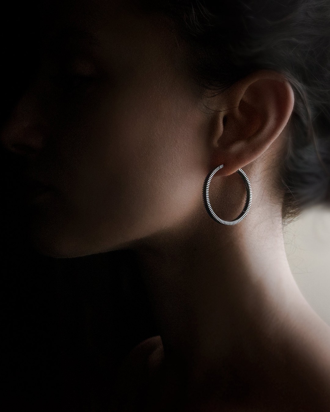 Jewelry detail showing polished material and construction